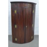 Mahogany and satin inlaid wall hanging corner cupboard, the cornice with a cube parquetry paterae