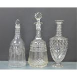 Two 19th century decanters and stoppers and another with star etched pattern, tallest 32cm (3)