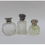 Three scent bottles to include a late Victorian silver topped scent bottle, Birmingham 1900, with