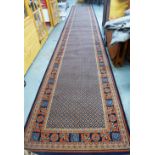 Large wool runner with a blue field and multiple borders, 900 x 138cm