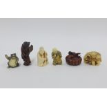 Six various netsukes in fruitwood and marine ivory to include an elephant, cobra and a cat, etc,