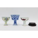 Chinese porcelain stem cups to include one with blue and white dragon pattern another with Doucai