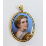 A hand painted porcelain plaque pendant, in the manner of Berlin, showing a young woman with