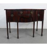 Mahogany serpentine sideboard of small proportions, with central long drawer flanked by single