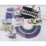 Quantity of Zulu beadwork collars, head bands, necklaces and a back cape, etc (a lot)