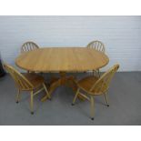 Ercol light elm dining table and set of four chairs, 149 x 73 x 98cm (5)