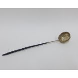 18th century white metal toddy ladle with floral embossed bowl, inscribed 'Susannah Ann Laming