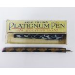 Platignum self filling fountain pen with its box and an unusual marbled fountain pen / nib holder