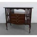 Edwardian mahogany music cabinet with three central drawers flanked by shelves and pierced