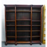 19th century mahogany triple bay open bookcase with adjustable shelves, on circular block feet,