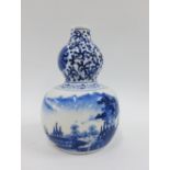 Chinese Ming style blue and white porcelain double gourd with four character marks to the base, 15cm