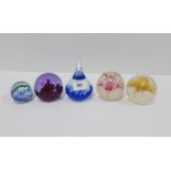 A collection of five Caithness glass paperweights and another, (6)