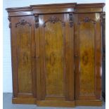 Victorian mahogany and walnut triple breakfront wardrobe, moulded cornice over three carved doors,