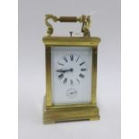 French brass and glass panelled repeater carriage clock, striking on a gong, 19cm high
