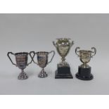 Four small silver trophy cups, , tallest 10cm (4)