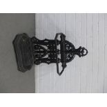 Black painted cast iron stick stand with two divisions, 55 x 83 x 23cm