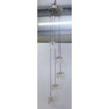 Modern light fitting hung with five clear glass cubes