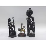 Indian bronze figure of a cow, 15cm high, and two African carved wood figures, (3)