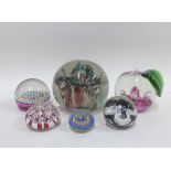 Collection of six glass paperweights to include an Edinburgh millefiore and Caithness, etc (5)