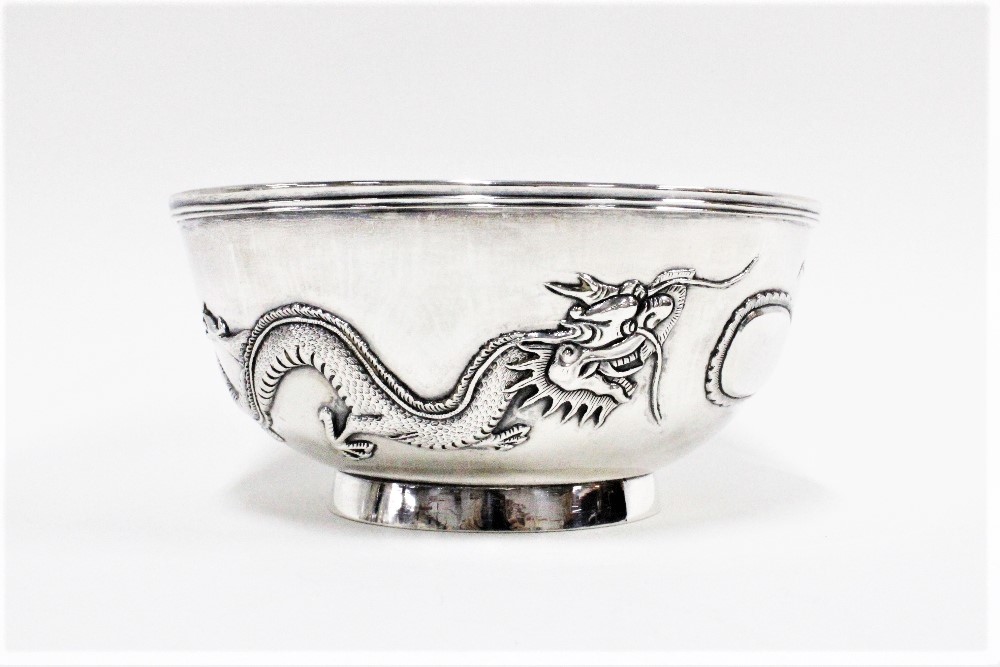 Chinese silver dragon pattern bowl, on a plain circular footrim with makers marks to the