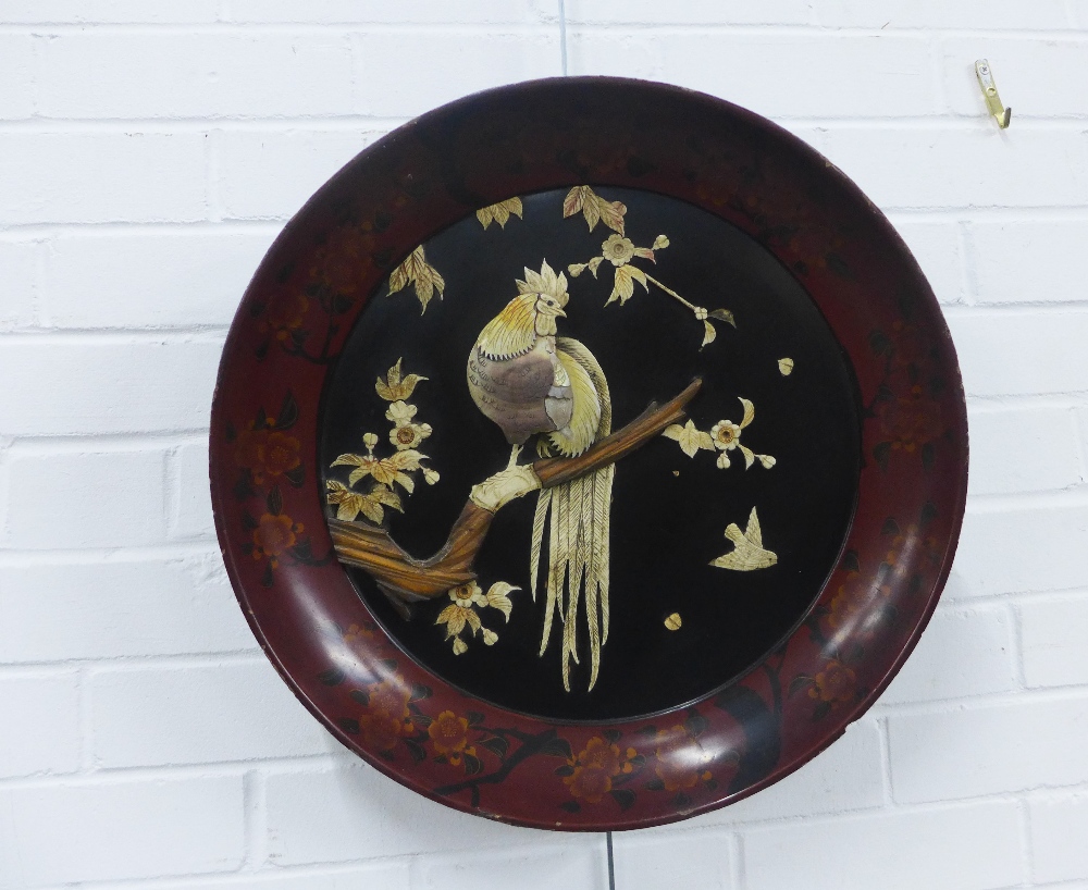 Japanese lacquered circular wall charger with a bird perched on a branch pattern, 46cm diameter