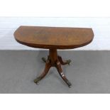 19th century walnut fold over tea table with demi top on an octagonal column with four outswept