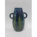 Continental art pottery vase with looping handles and a green and blue streaked glaze, 32cm