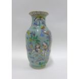 Chinese famille rose and celadon glazed vase with figures in blue and white, 23cm high