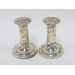 Victorian pair of silver candlesticks, Sheffield 1876, with beaded rims, weighted, 12cm high (2)