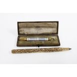 Gold and guilloche enamel propelling pencil, with roses pattern, stamped 9k, in original Elkington &