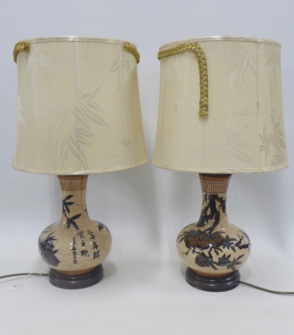 A pair of pottery table lamp bases with shades, (2)