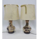 A pair of pottery table lamp bases with shades, (2)