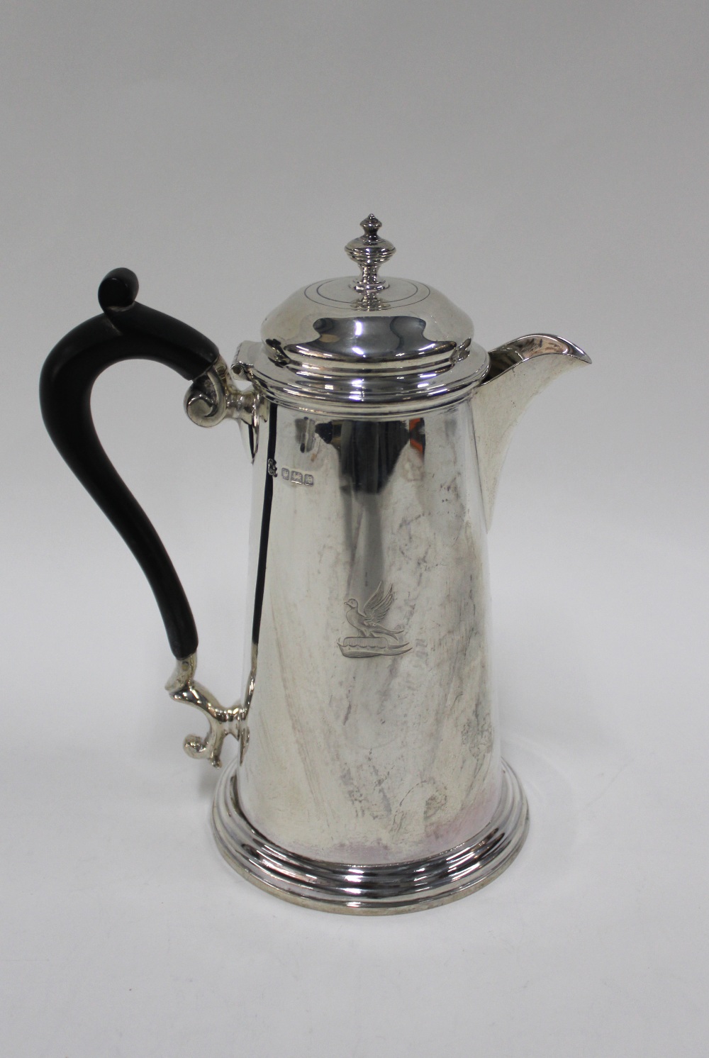 George V silver hot milk pot, of tapering cylindrical form with a stepped circular base, Martin Hall