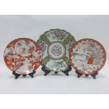 Famille rose charger and two Japanese Kutani plates, (a/f) (3)