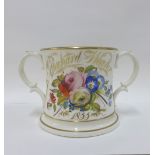 Victorian loving cup with toads and lizards to the interior, painted with flowers and inscribed