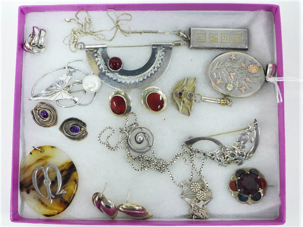 A collection of silver and white metal jewellery to include brooches, necklaces and earrings, etc (a