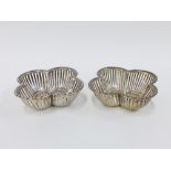 George V silver baskets, quatrefoil shaped with pierced sides, by William Hutton & Sons,