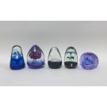 Collection of five glass paperweights to include a Strathearn weight with an S cane, Caithness '