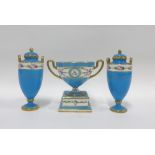 Mintons blue glazed urn vase with looping handles and a pedestal base together with a pair of