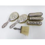 A collection of early 20th century silver backed brushes, etc ( 5)