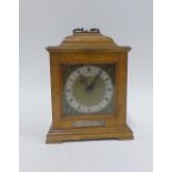 Walnut cased bracket style clock, with silvered chapter ring with Roman numerals, the brass dial