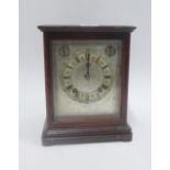 Mahogany cased mantle clock, the silvered dial with Roman numerals to the chapter ring and inscribed