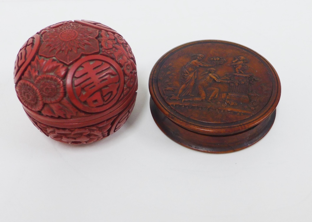 Red cinnabar circular box and cover, 6cm high together with a faux tortoiseshell box (2)