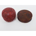 Red cinnabar circular box and cover, 6cm high together with a faux tortoiseshell box (2)