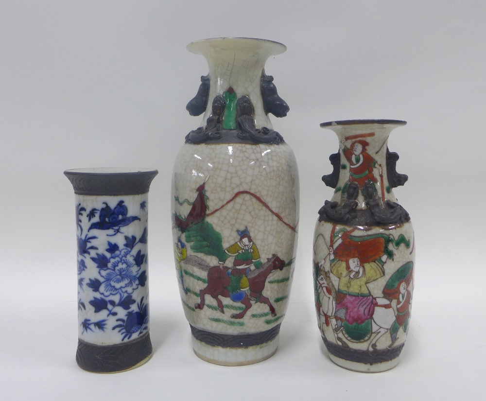 Three Chinese vases with brown incised borders, one with blue and white flowers, tallest 26cm (3)