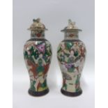 Pair of Chinese crackle glazed vases with warrior pattern and with brown incised bands, (a/f) 31cm