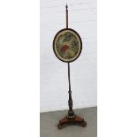 Early 19th century rosewood pole screen with brass finial and mounts and a triform platform base