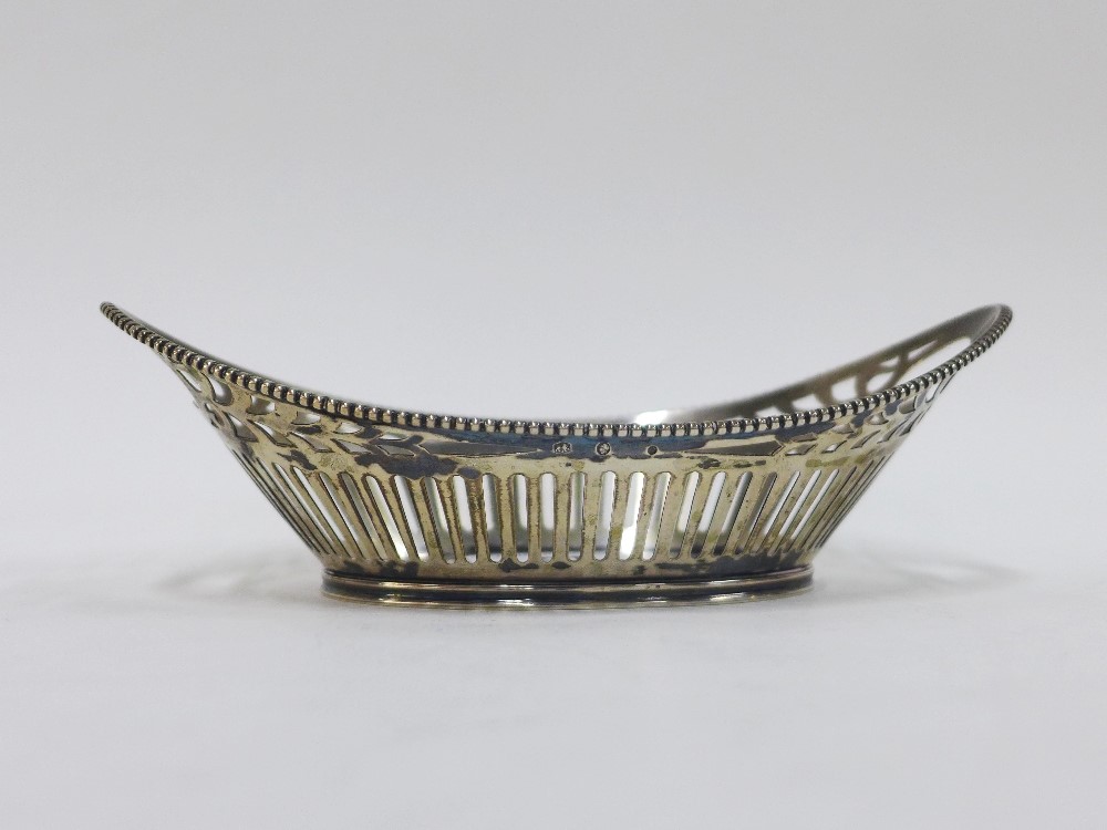 Continental silver basket of oval form with open handles and pierced sides, 18cm long