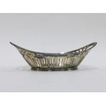 Continental silver basket of oval form with open handles and pierced sides, 18cm long