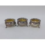 Three Edwardian silver salts with clear glass liners, Chester 1909, 7cm wide (3)